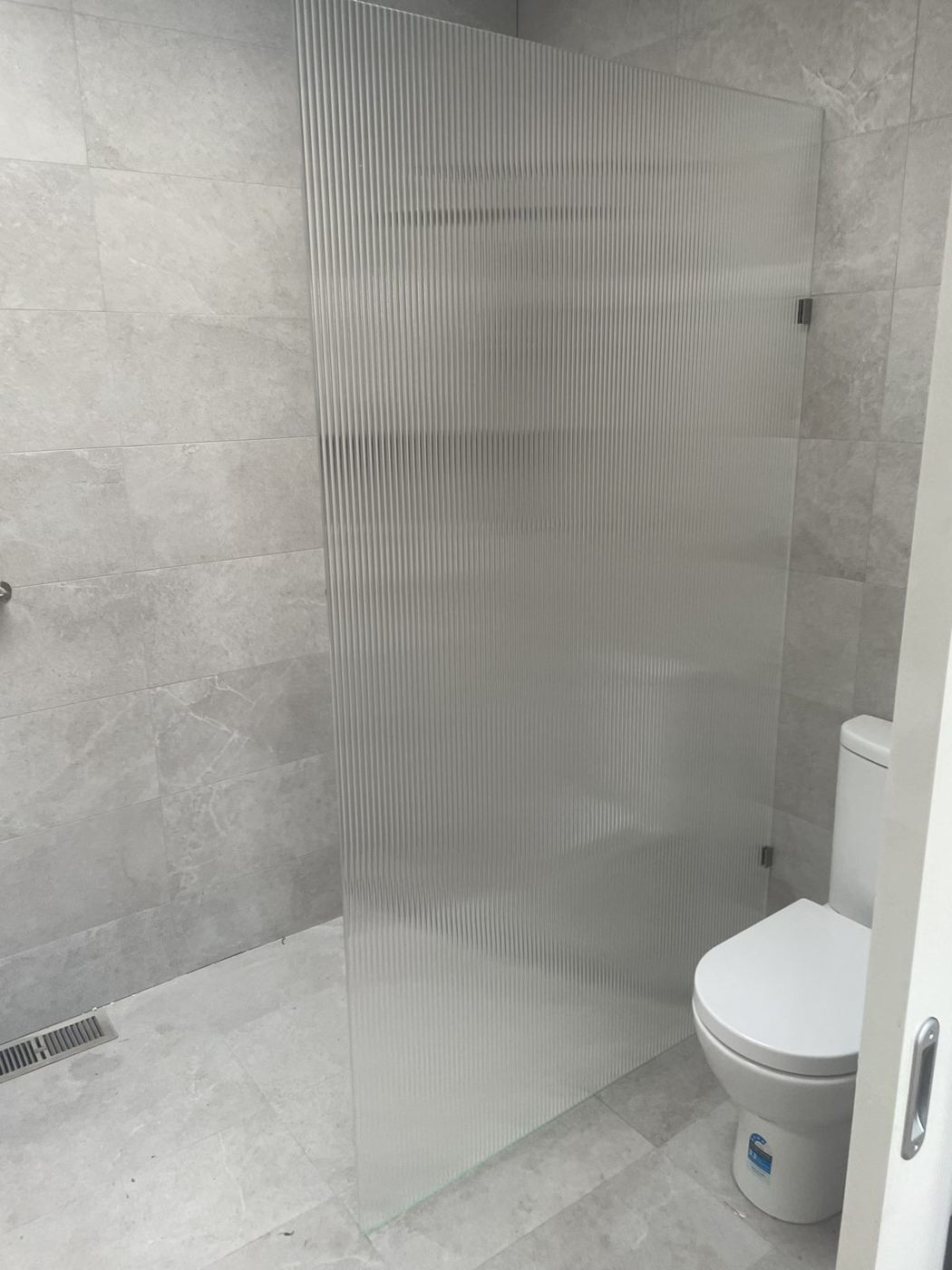 Fluted glass shower panel