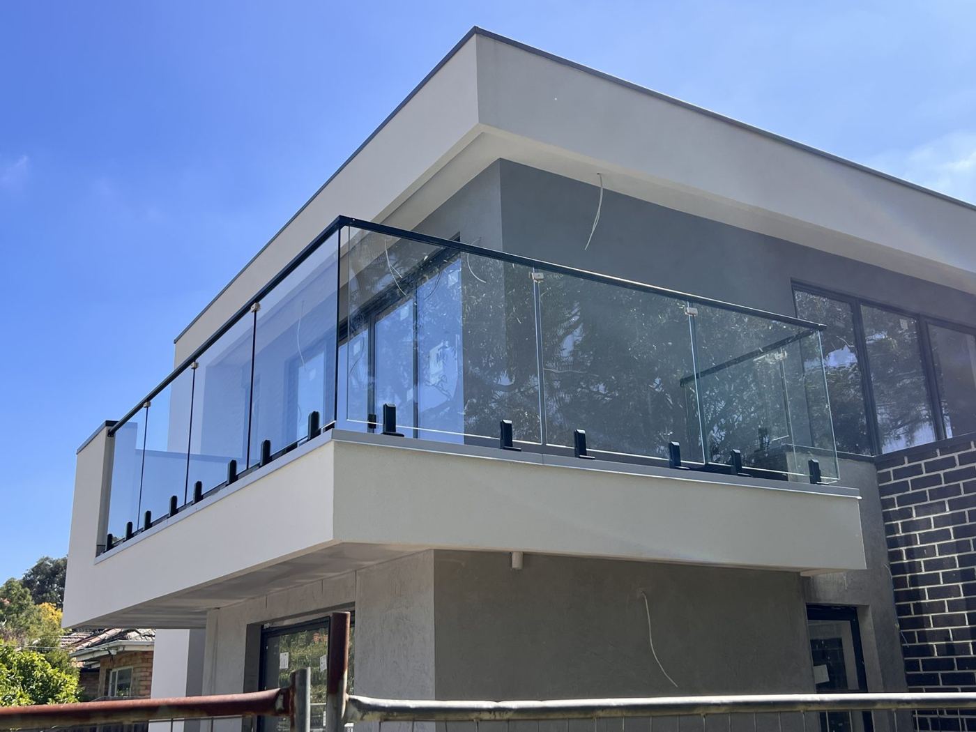 Frameless glass balcony balustrade on a new home