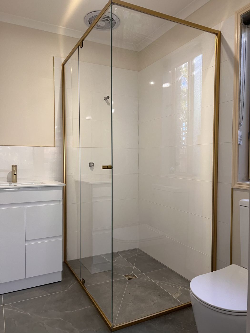 Brushed gold semi-frameless shower screen, 2050 mm high